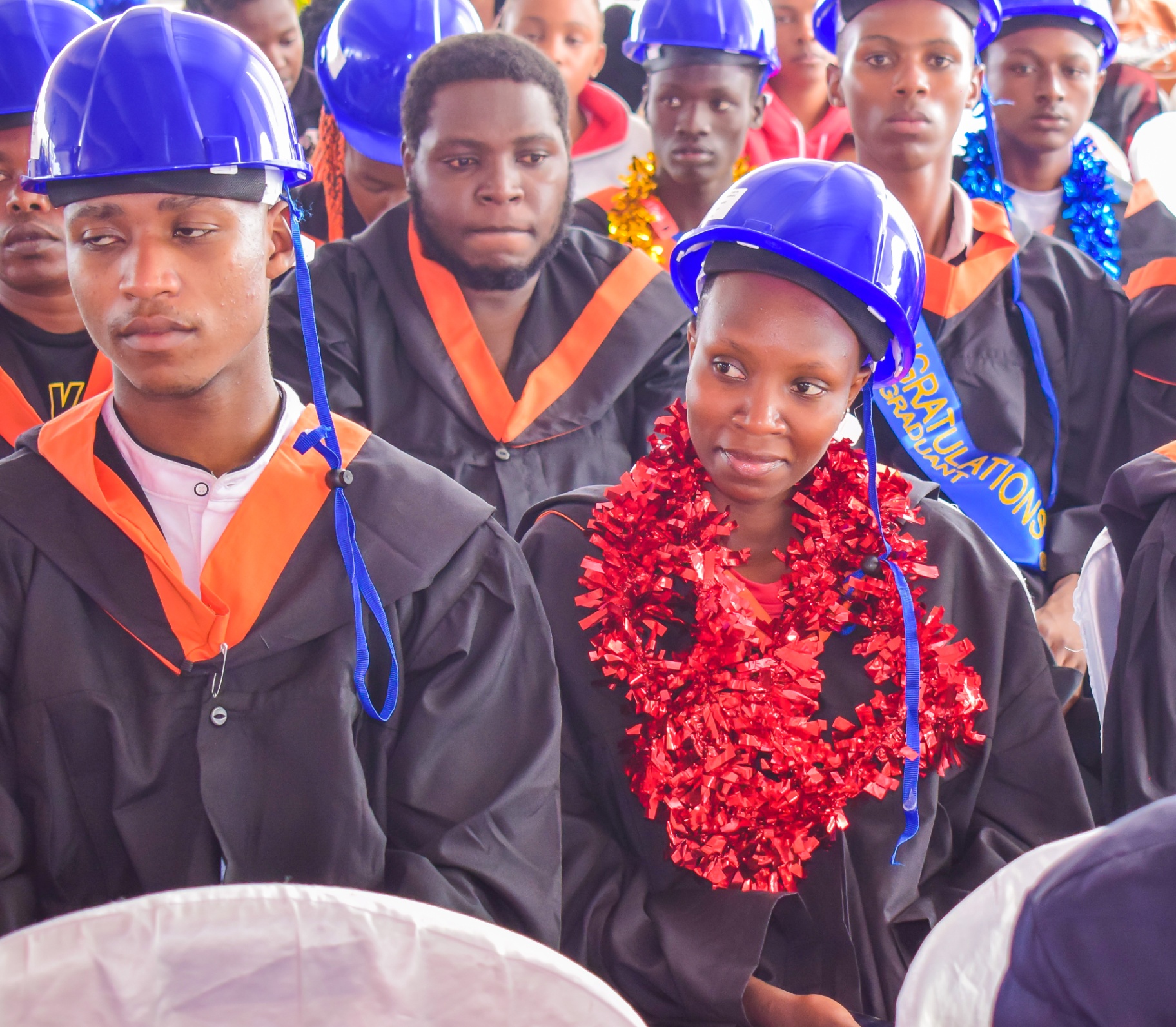 Graduates in caps and gowns during ceremony
